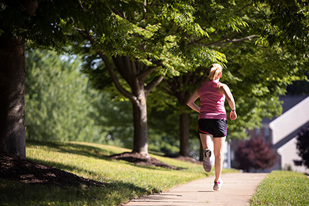 woman running on the sidewalk